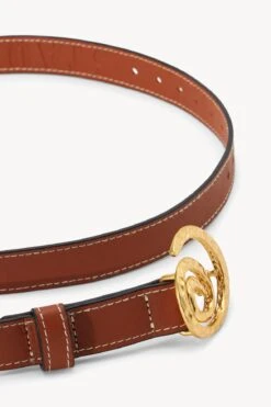 SWIRL BUCKLE BELT | TAN -Staud STAUD SWIRL BUCKLE BELT 25MM TAN HOLIDAY 22 ECOM 2